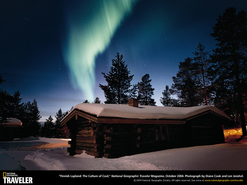 Aurora over a log cabin