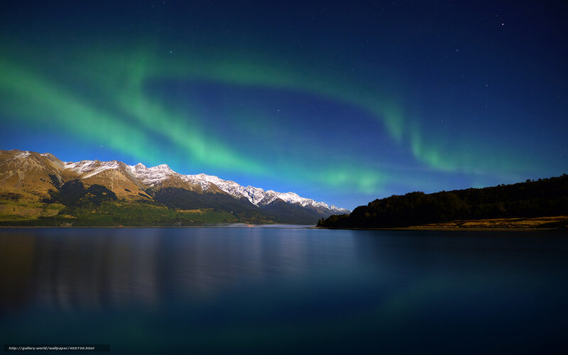 Aurora over a mountain lake