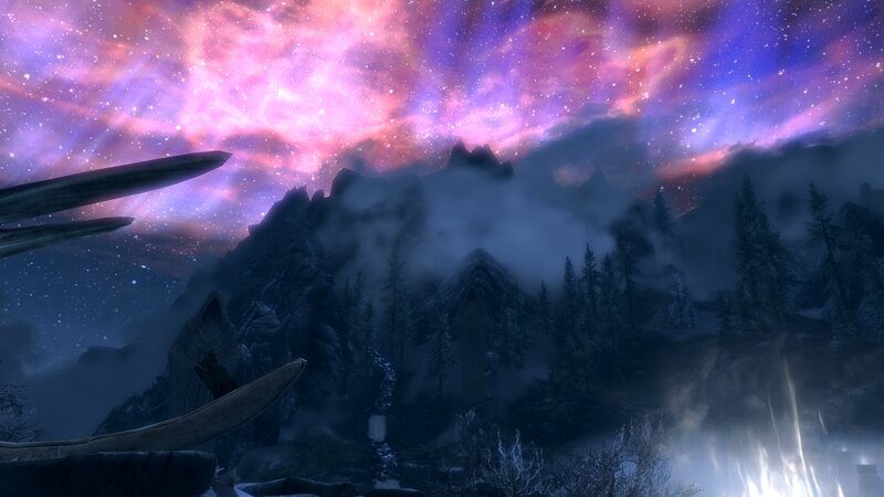 Aurora over a mountainous landscape