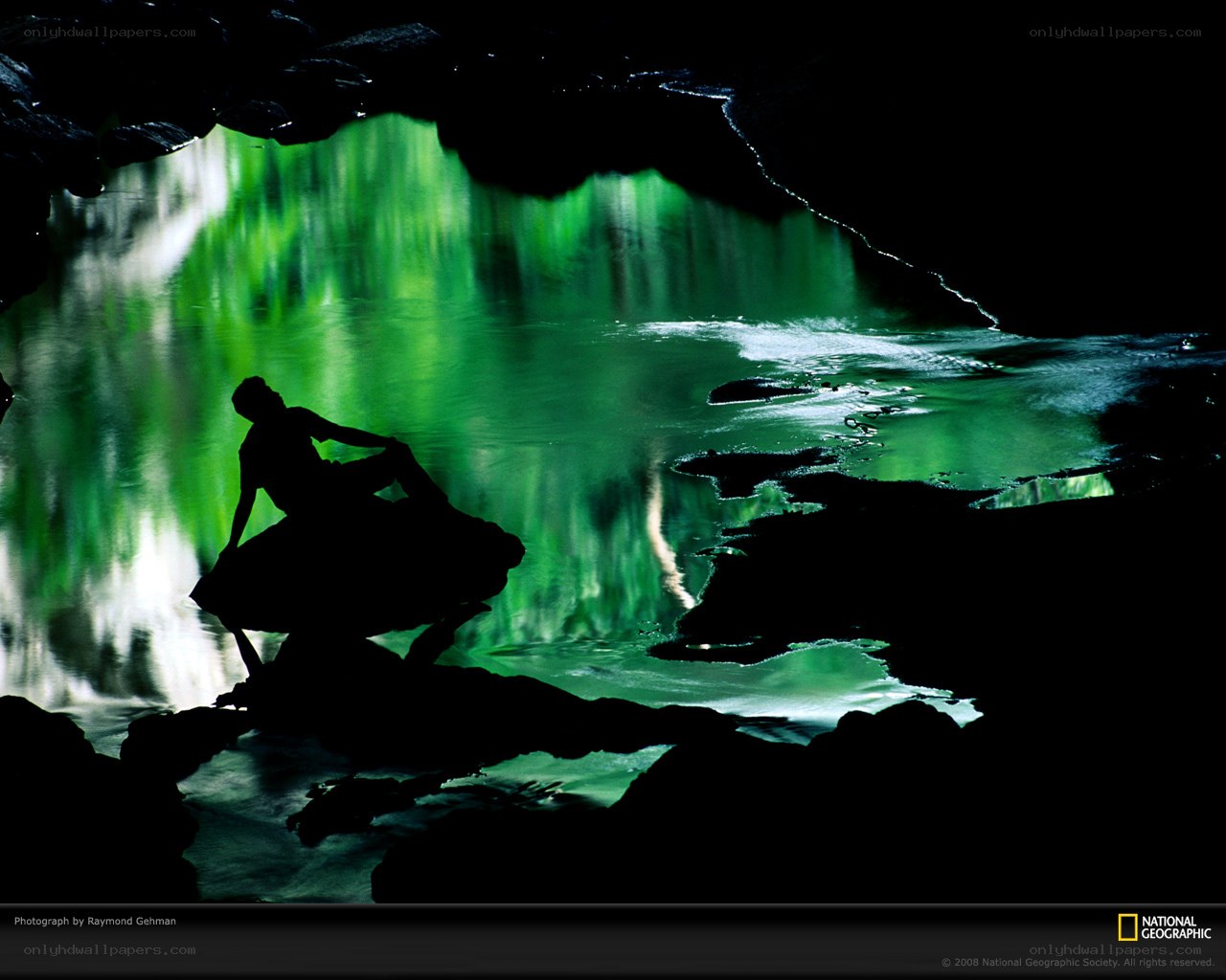 Aurora over a river at night