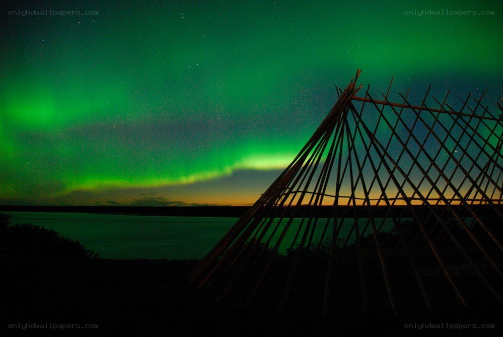 Aurora over a traditional structure