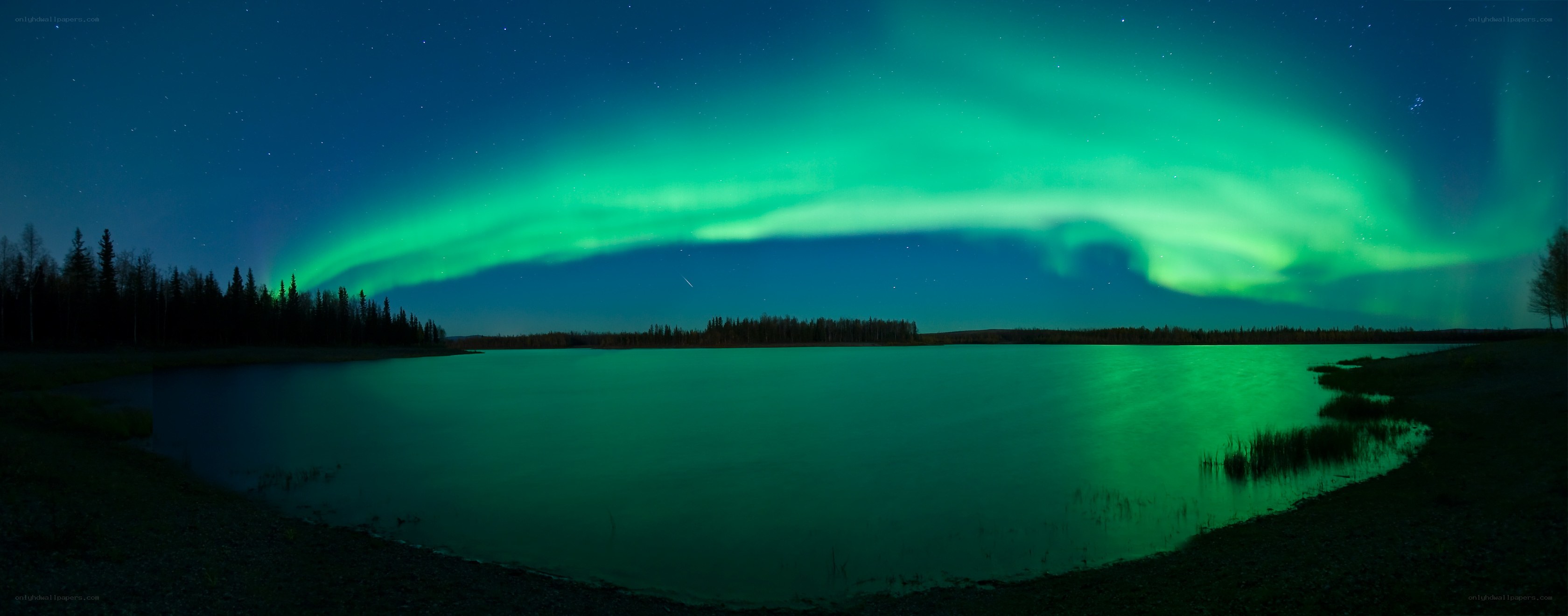 Aurora over a tranquil lake