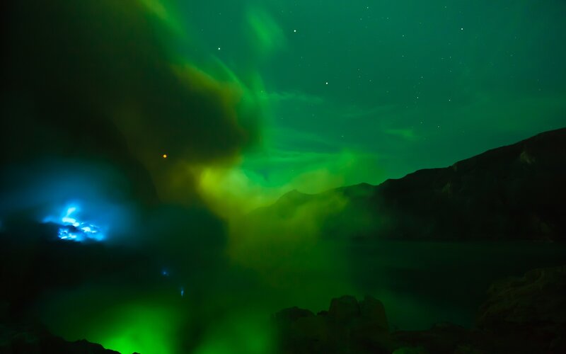 Aurora over a volcanic landscape