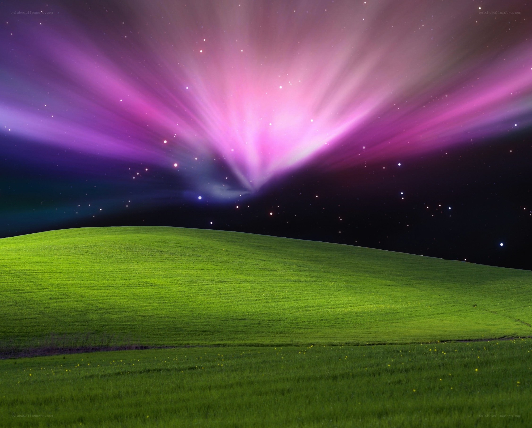 aurora over green hill