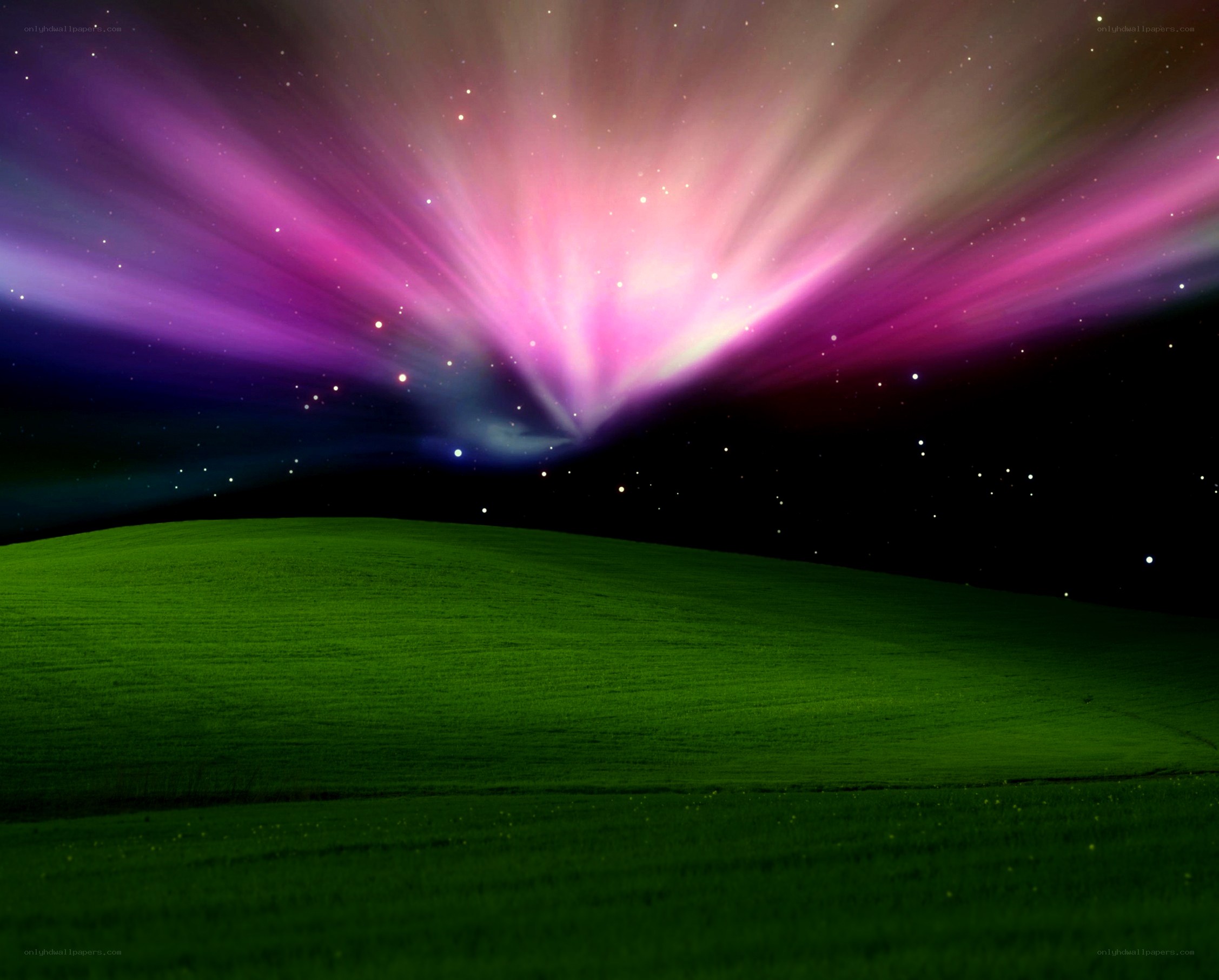 aurora over green hills