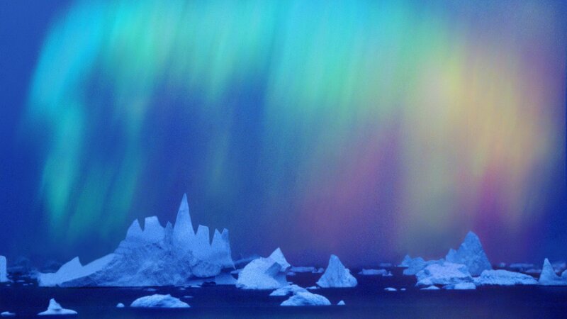 Aurora over icebergs