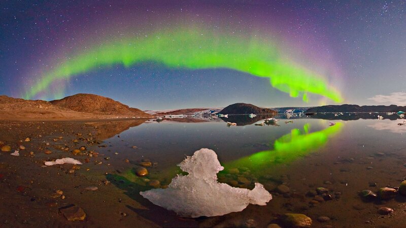 Aurora over icy landscape