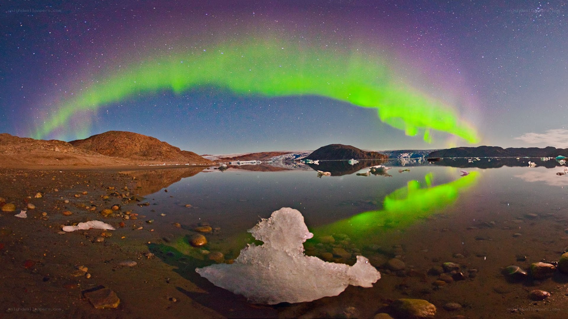 Aurora over icy landscape