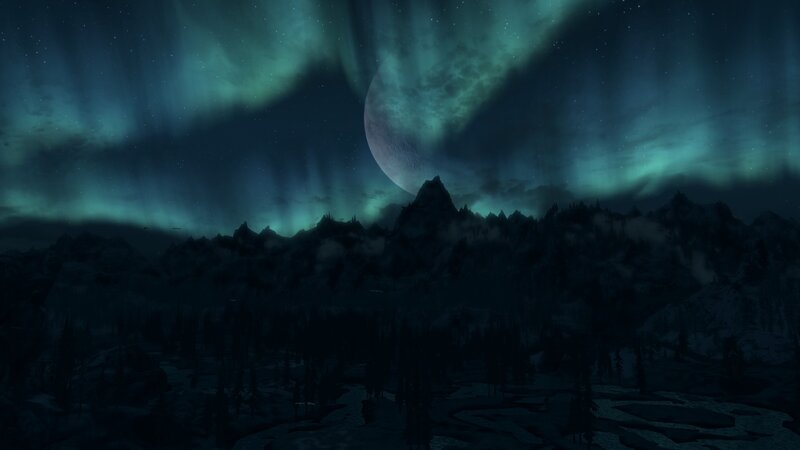 aurora over mountain range