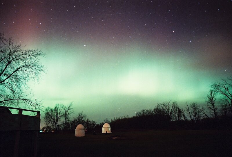 Aurora over observatory domes
