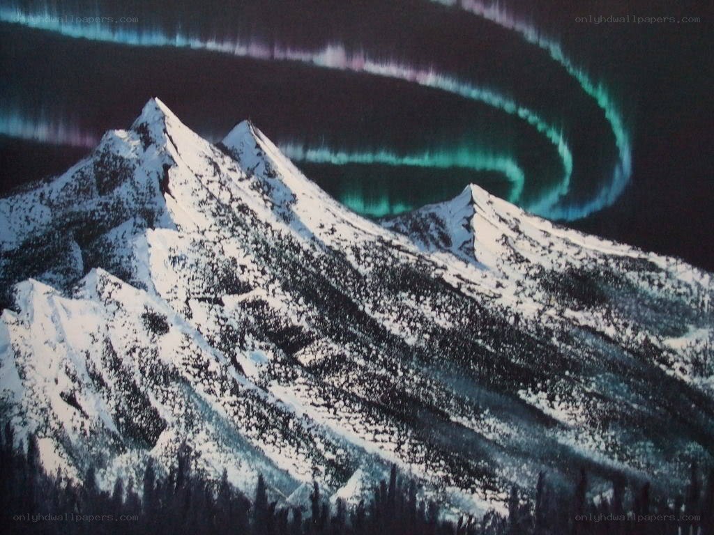 Aurora over snow-capped mountains