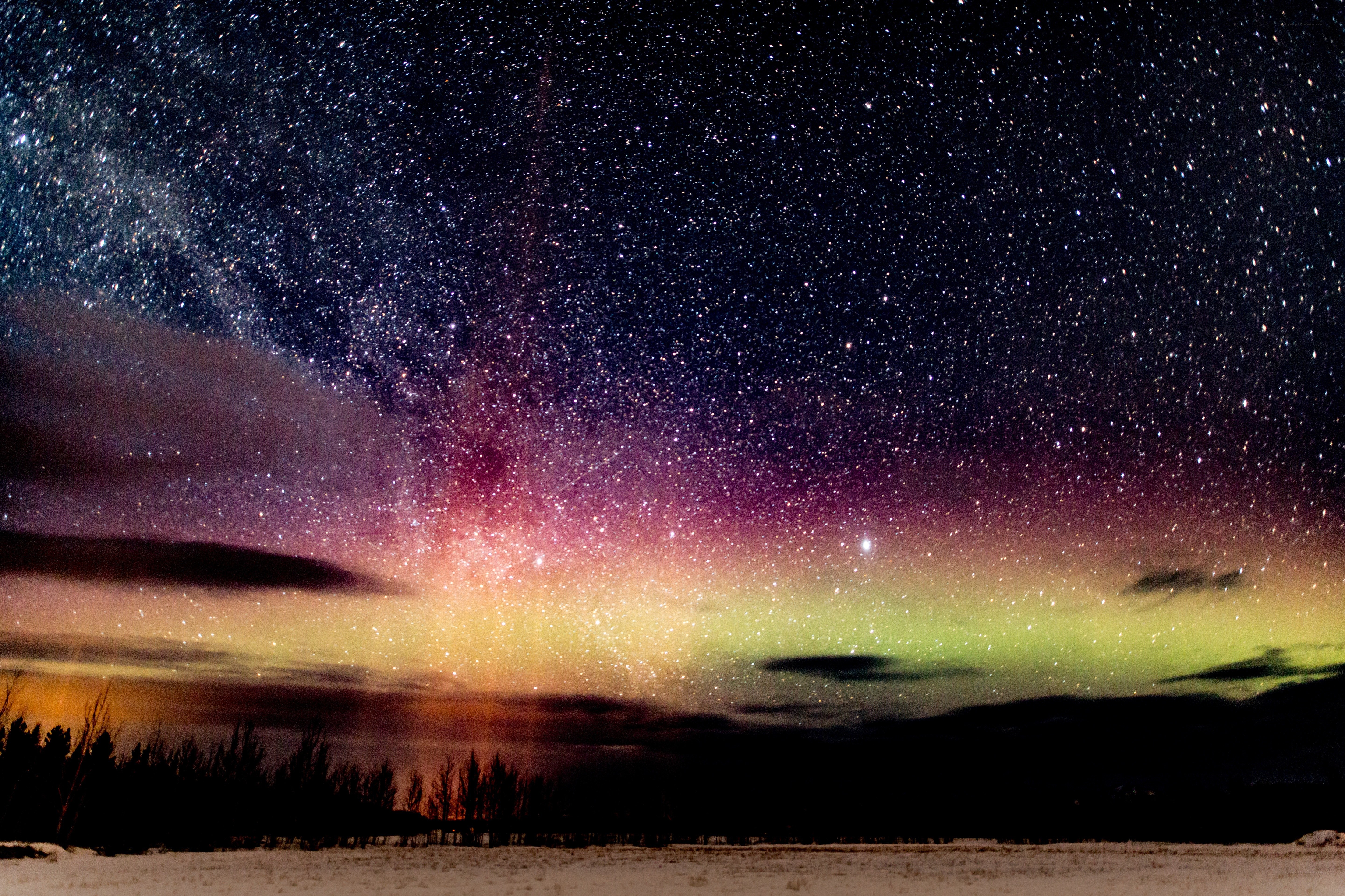 Aurora over snowy landscape