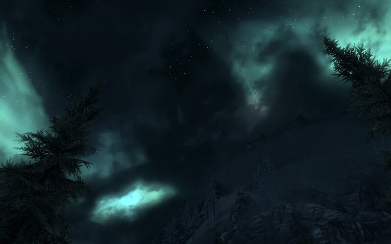 Aurora over snowy mountains