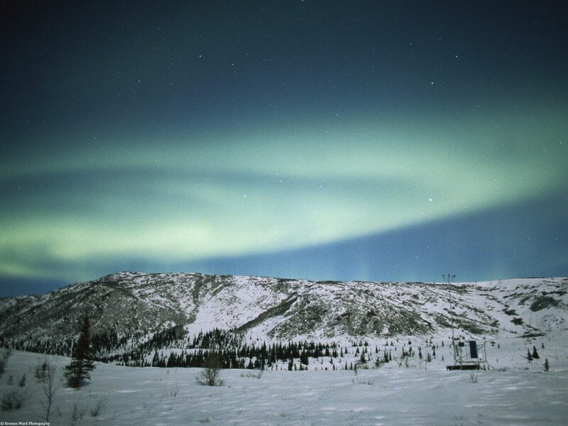 Aurora over snowy mountains