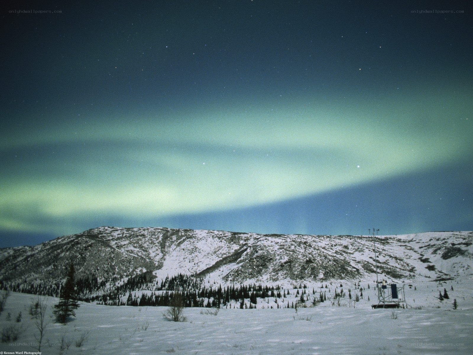 Aurora over snowy mountains