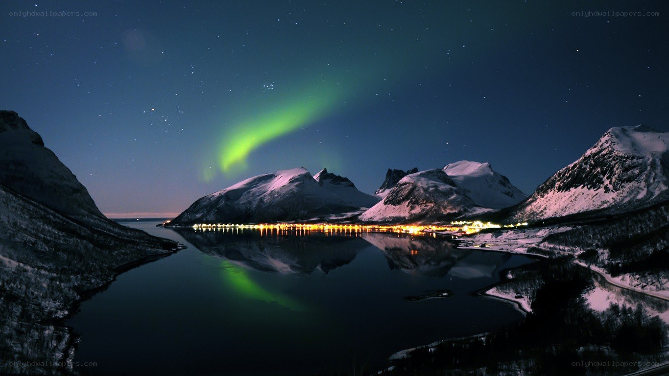 Aurora over snowy mountains