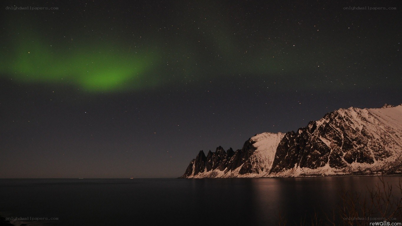 Aurora over snowy mountains