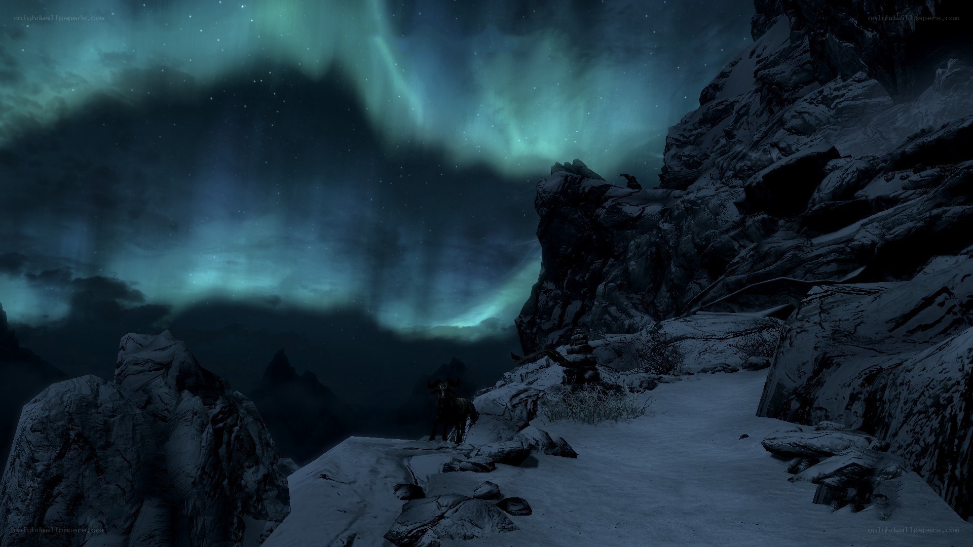 aurora over snowy mountains