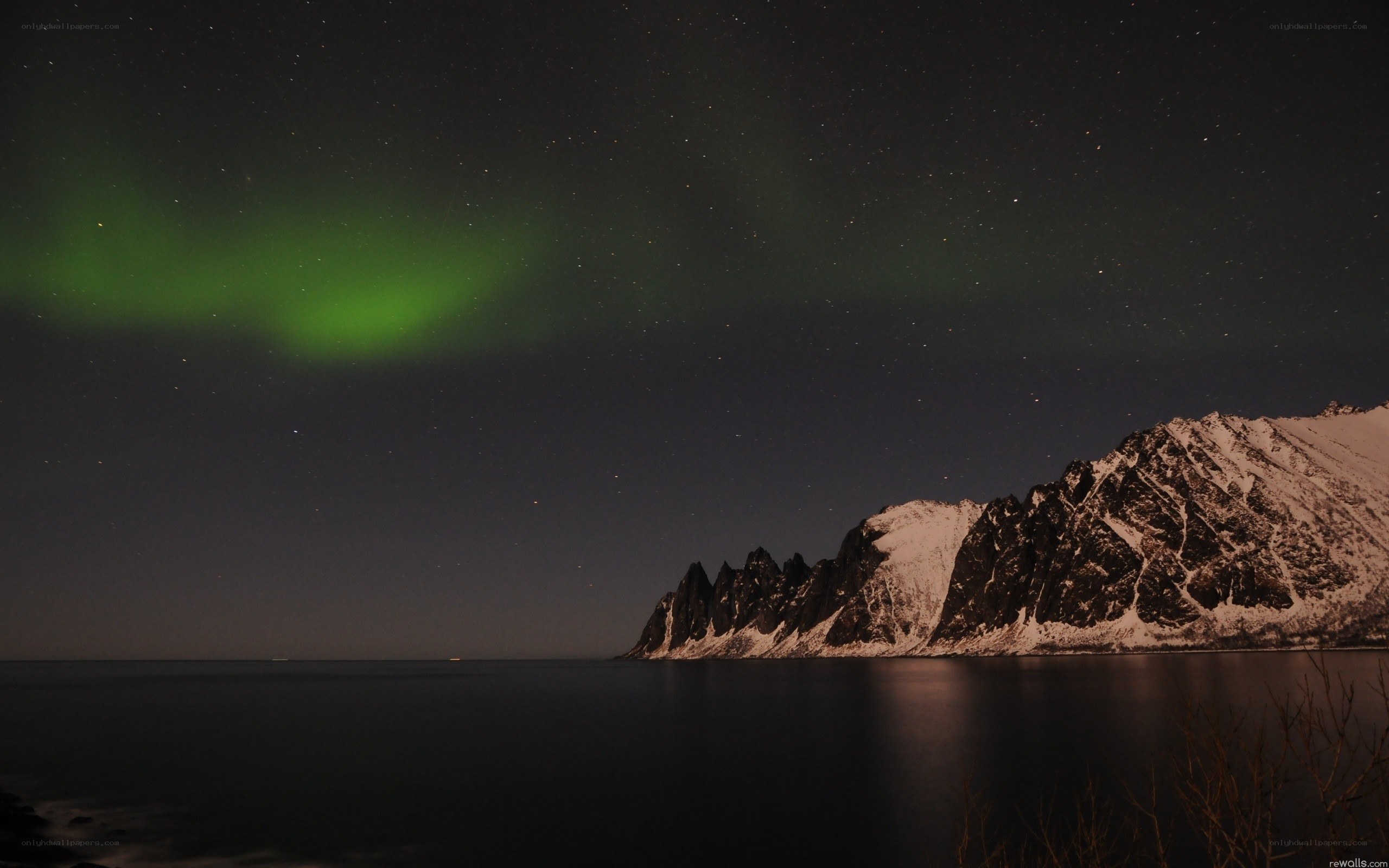 Aurora over snowy mountains