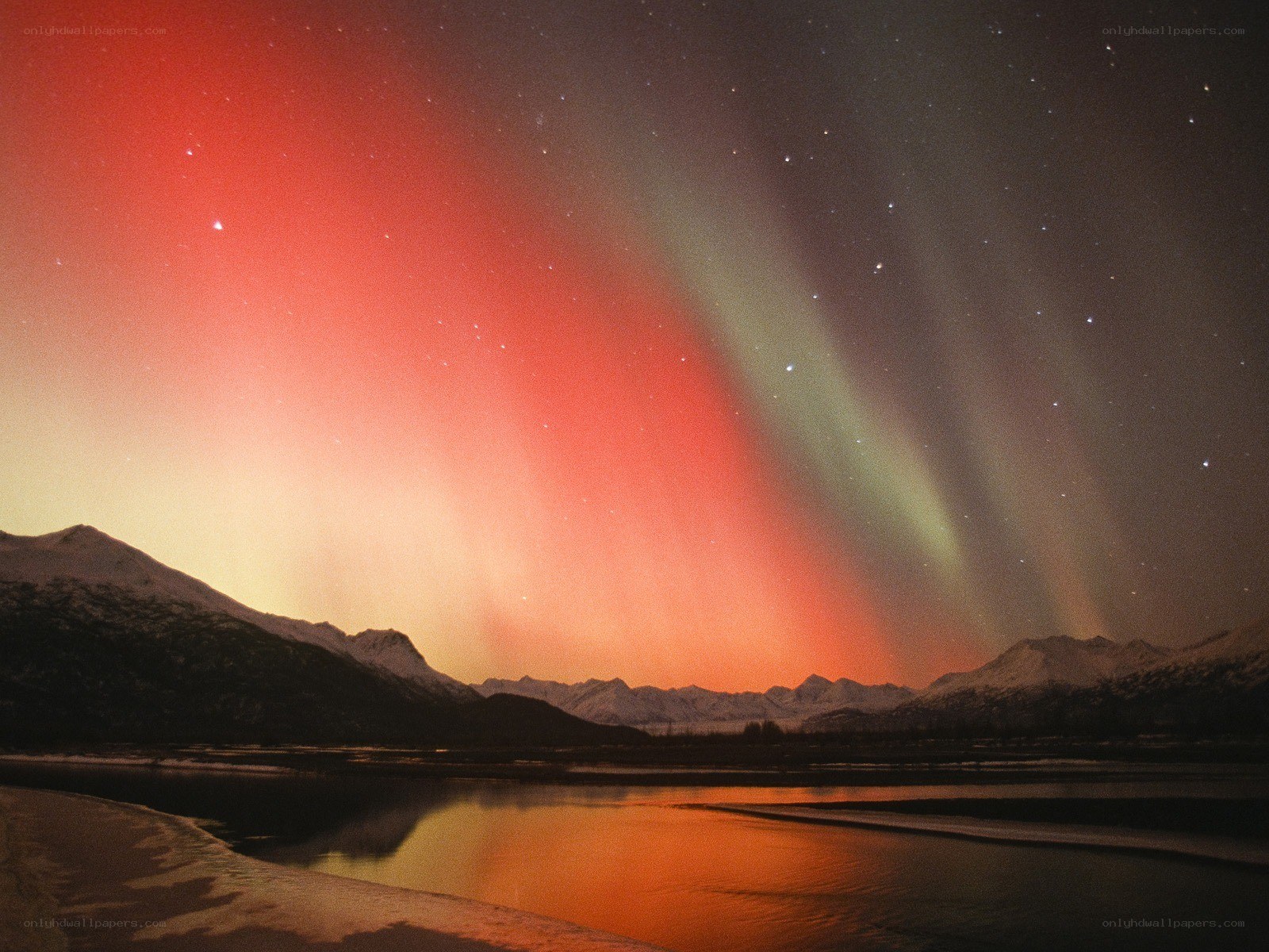 Aurora over snowy mountains
