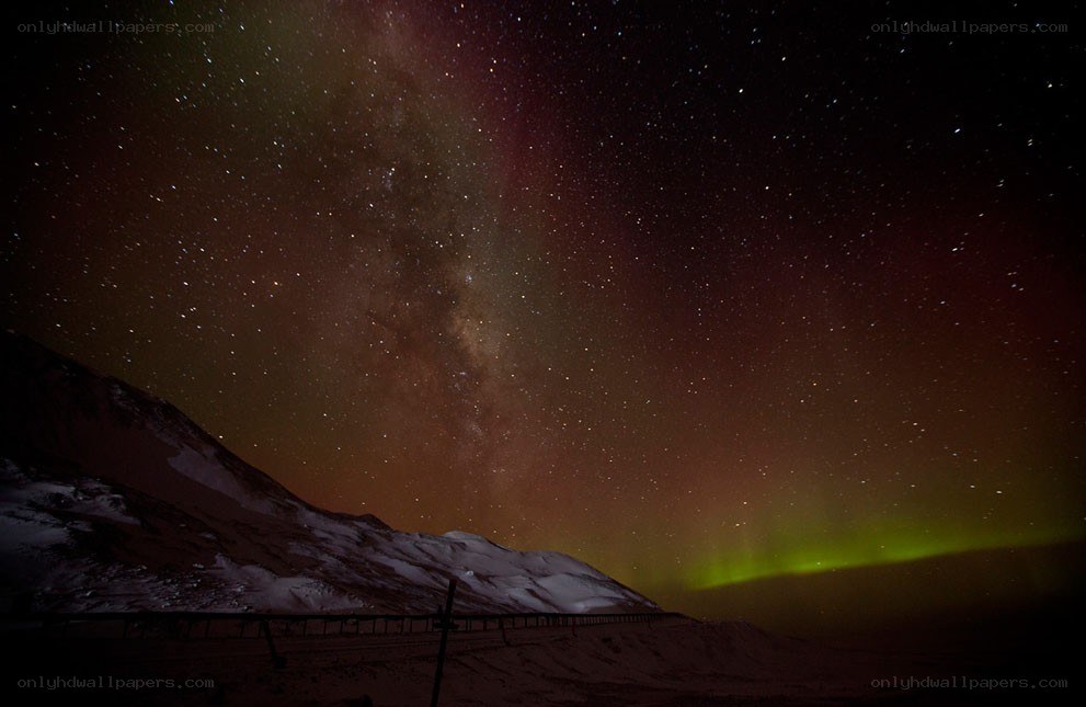 Aurora over snowy mountains