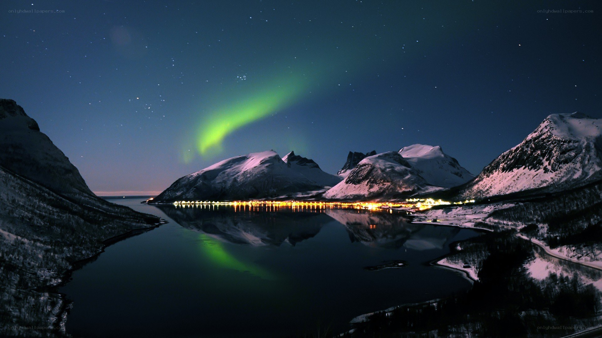 Aurora over snowy mountains