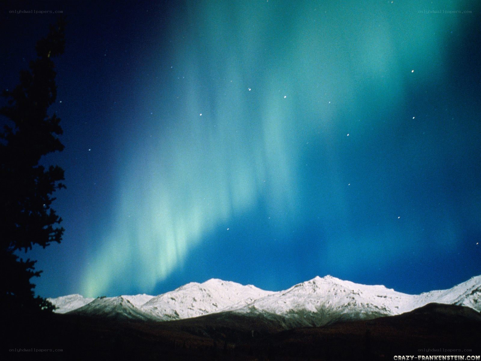 Aurora over snowy mountains