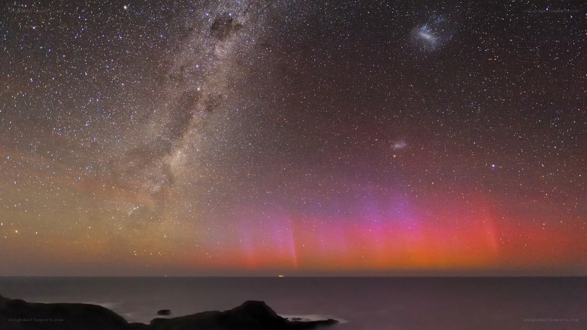 Aurora over the ocean at night