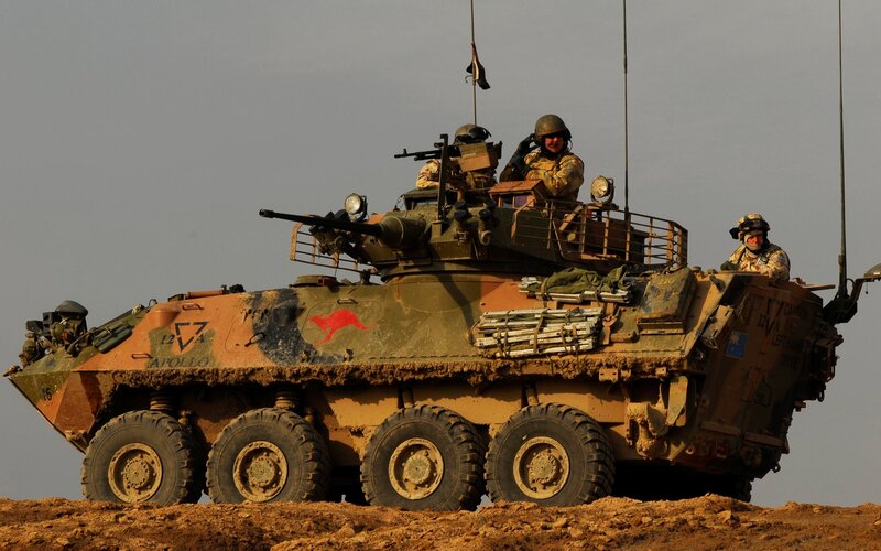 Australian soldiers in armored vehicle