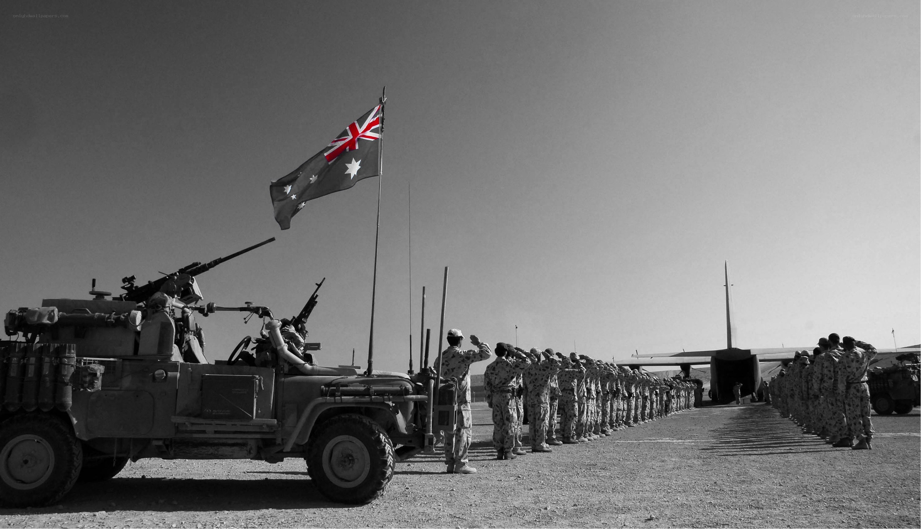 Australian soldiers salute flag