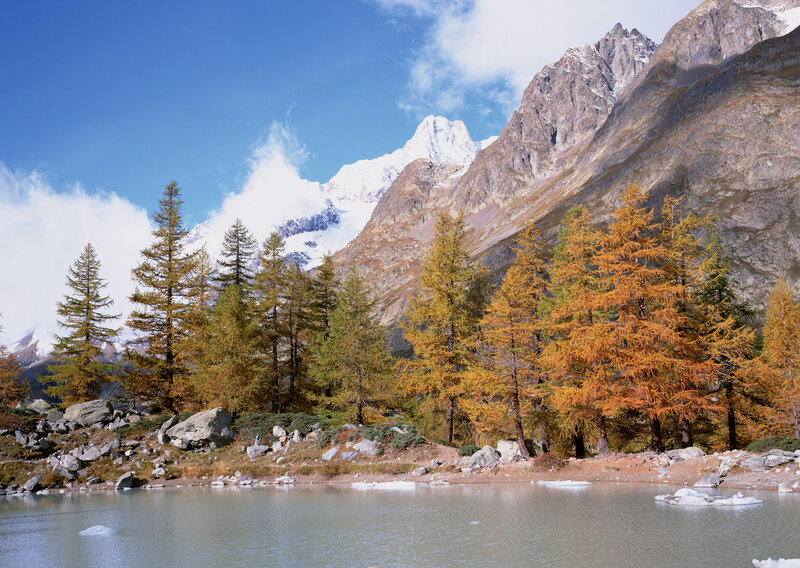Autumn alpine lake with snow-capped peaks