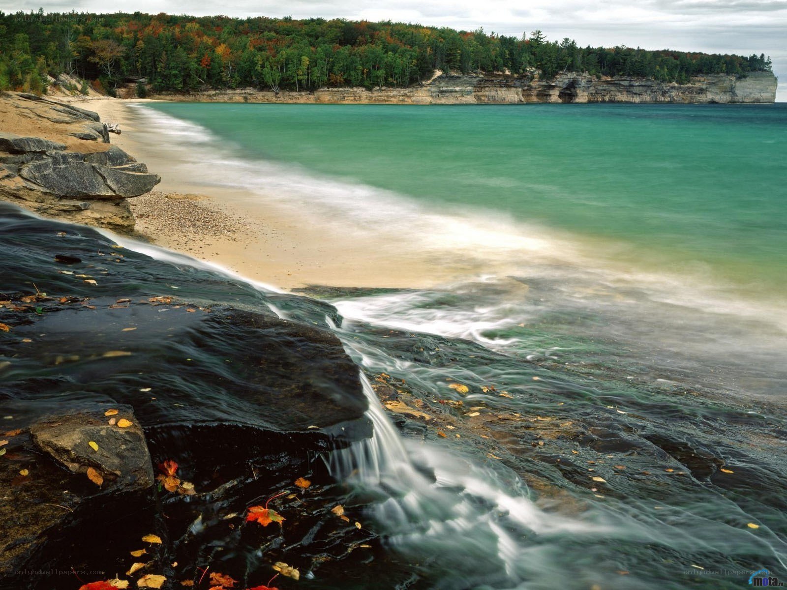 autumn beach with waterfall