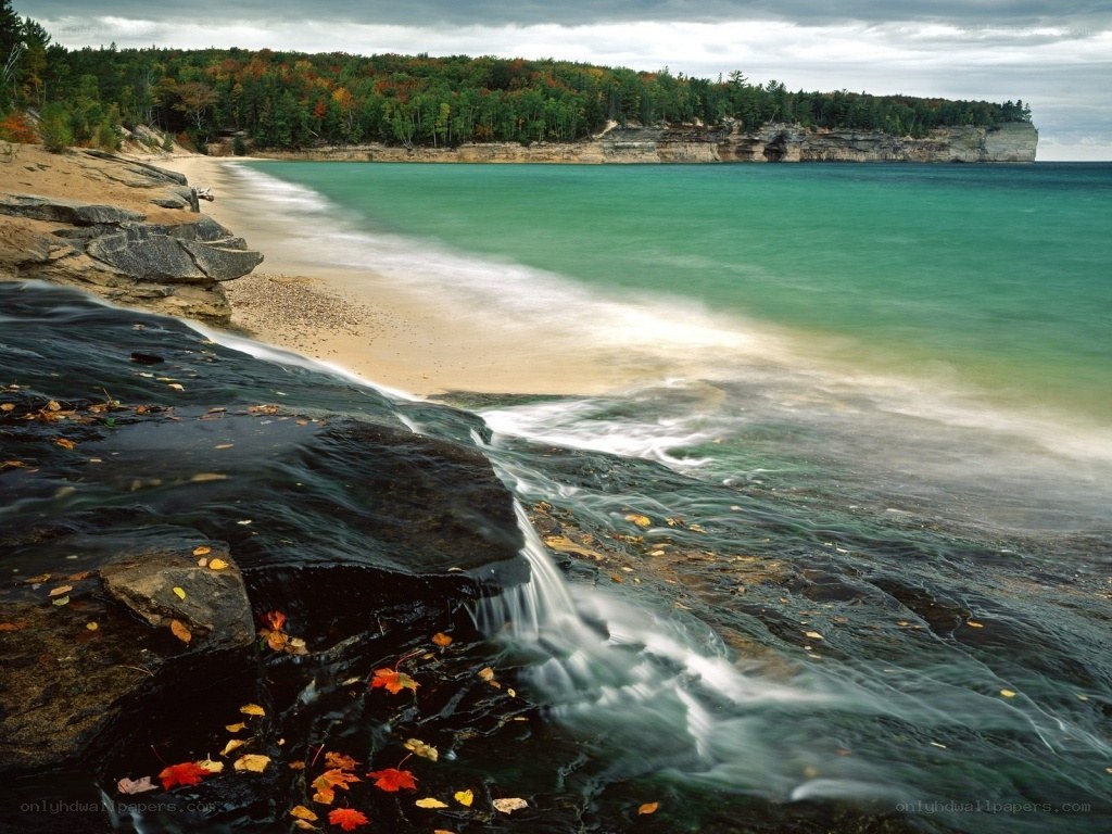 autumn beach with waterfall