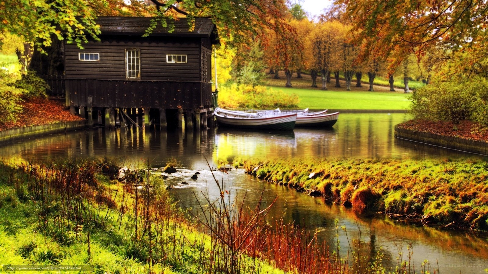Autumn boathouse by the river