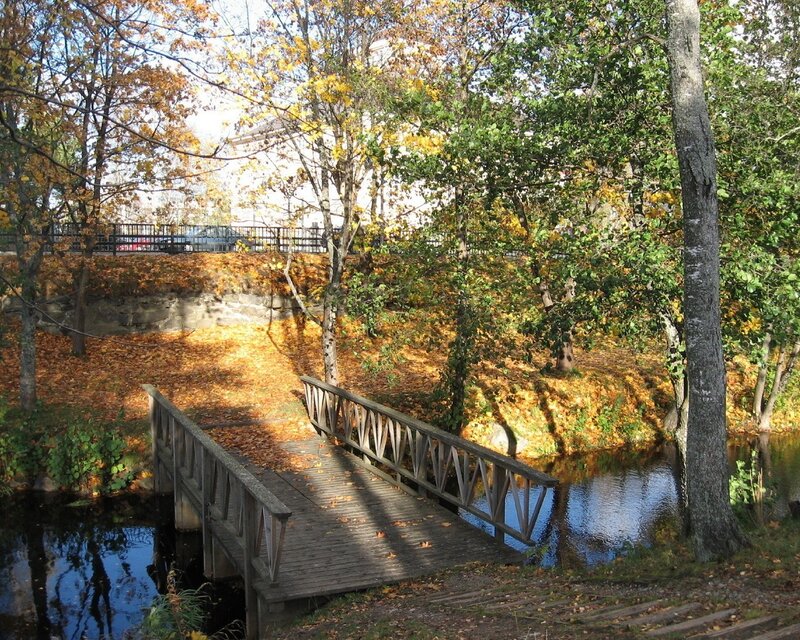 Autumn bridge over a stream