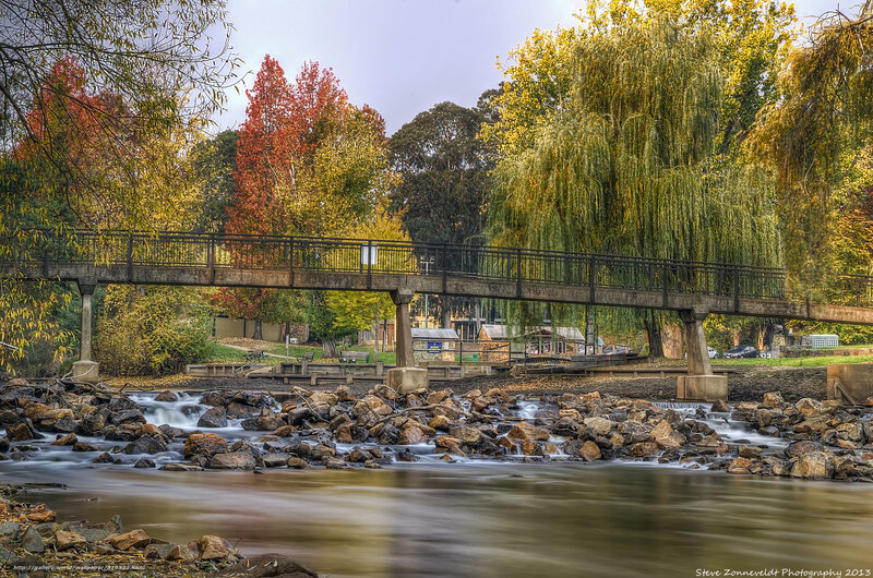Autumn bridge over river