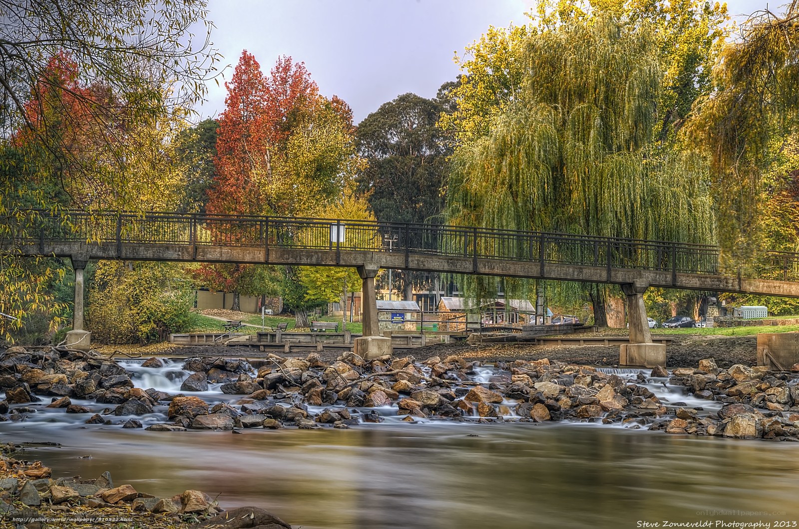 Autumn bridge over river