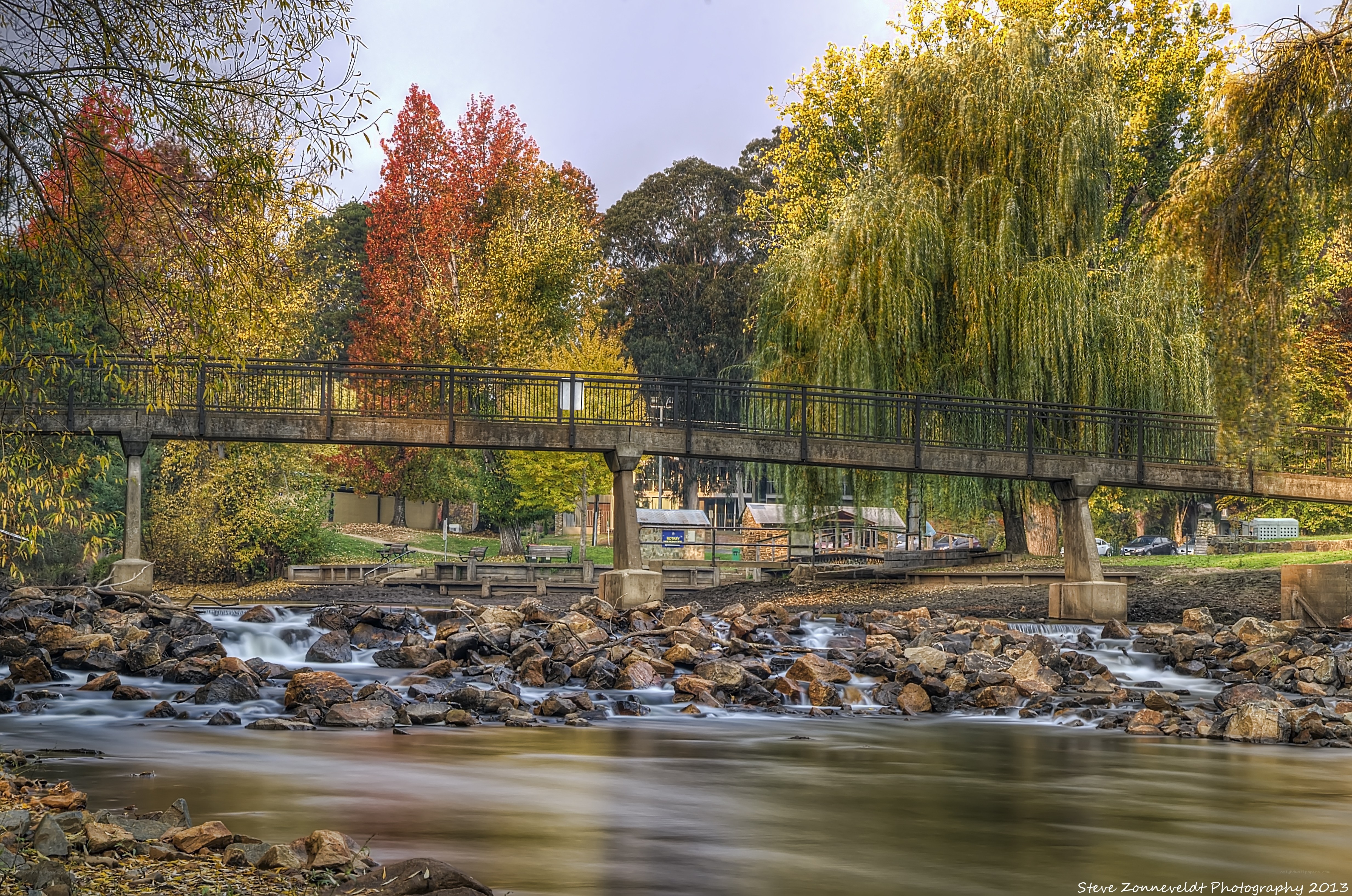 Autumn bridge over river