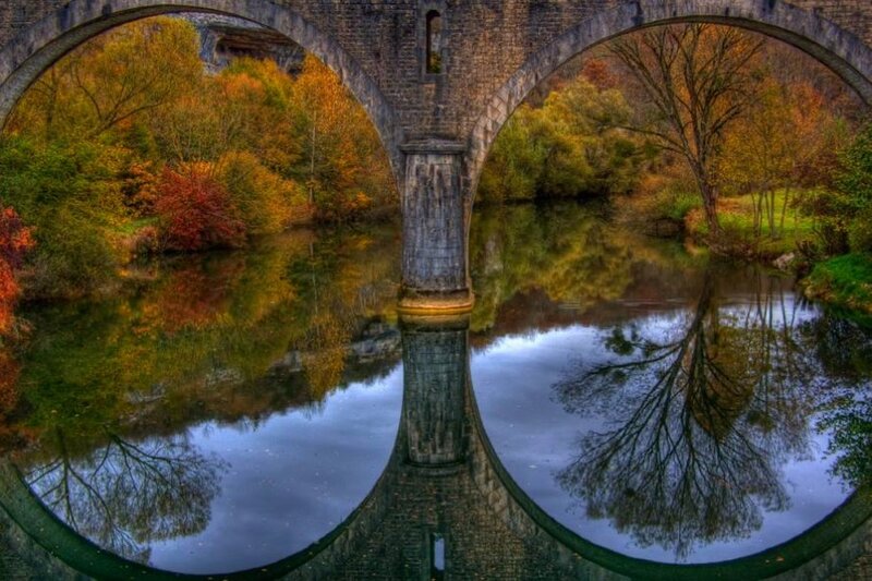Autumn bridge reflection