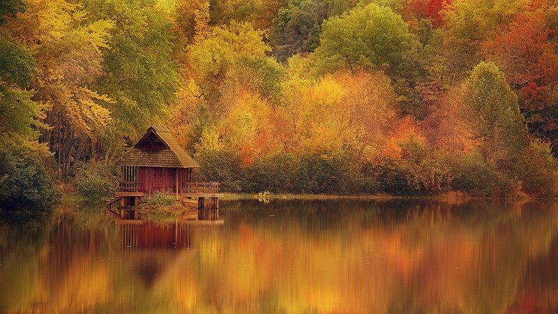Autumn cabin by the lake