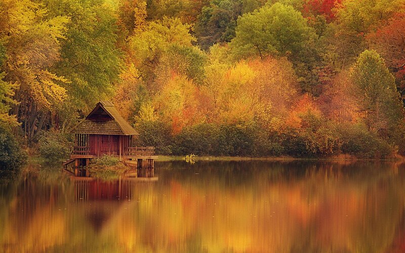 Autumn cabin by the lake
