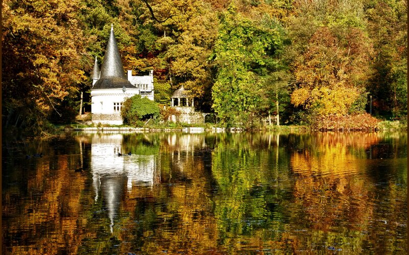 Autumn castle by the lake