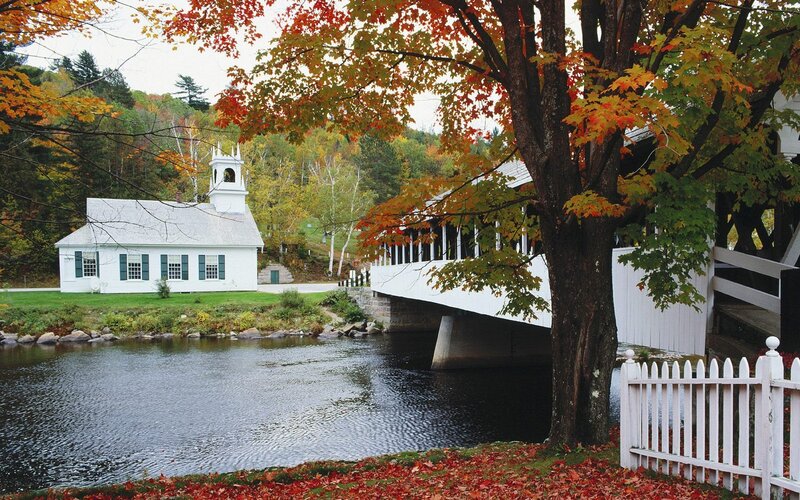 Autumn church and covered bridge