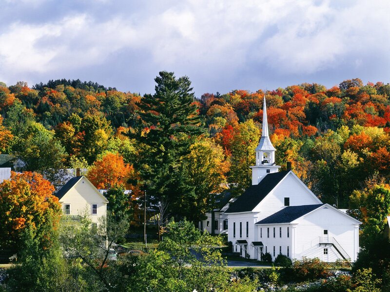 Autumn church in a forested town