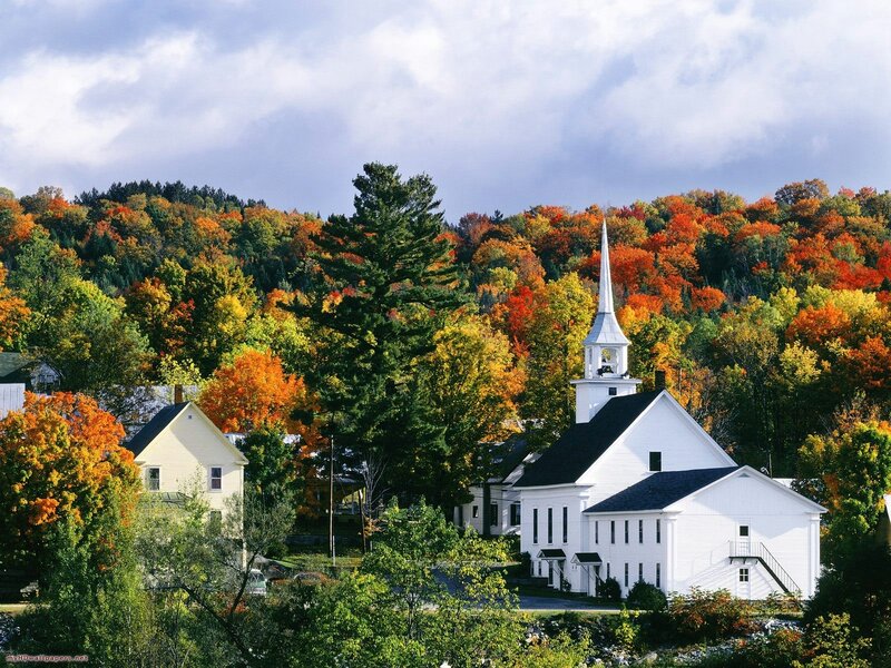Autumn church in a forested town
