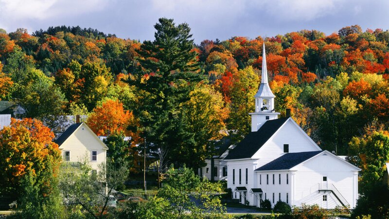 Autumn church in a forested village