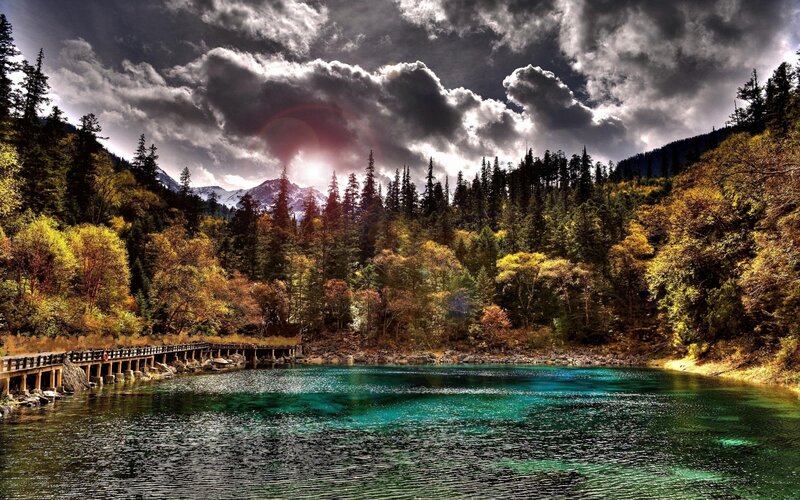 Autumn forest lake with mountain view