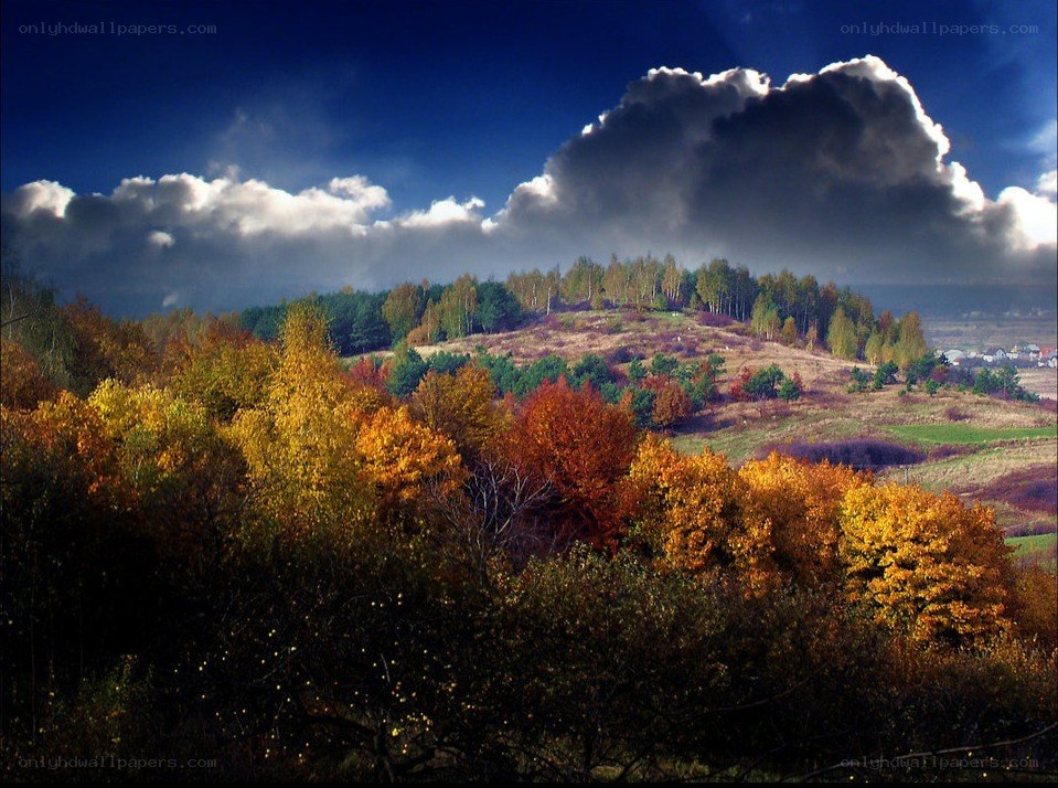 Autumn hills under dramatic sky