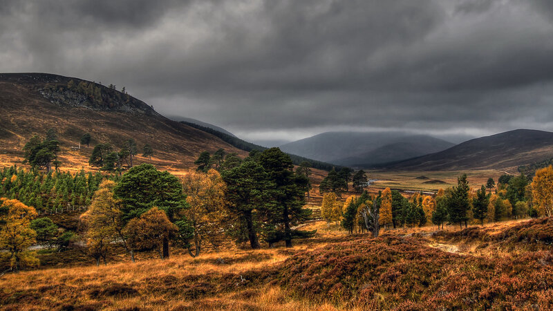 Autumn hills under stormy sky