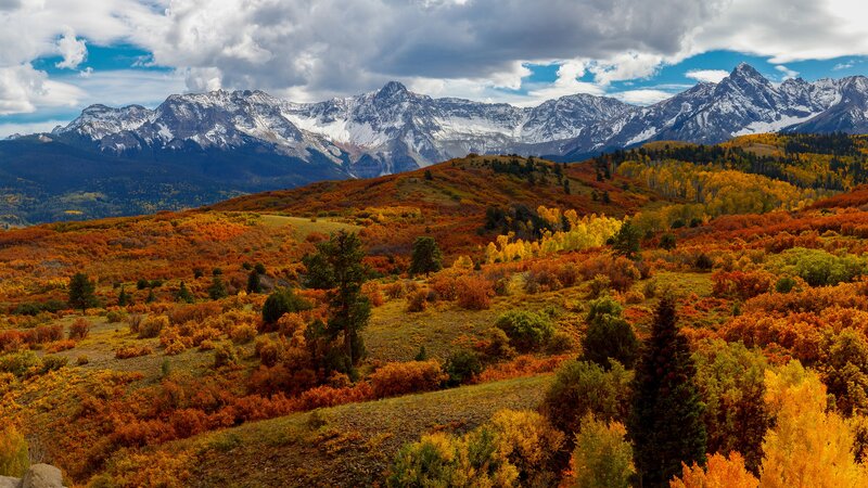 Autumn Hills with Snow-capped Mountains